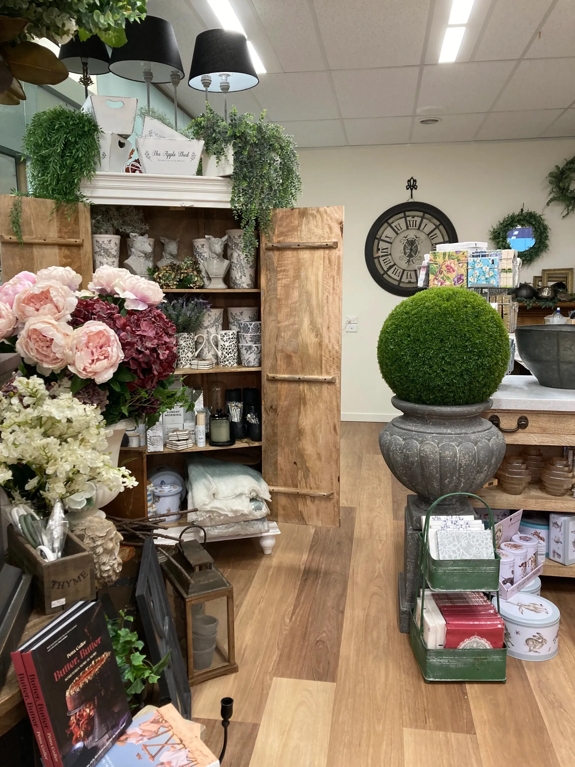 A room filled with lots of potted plants and flowers