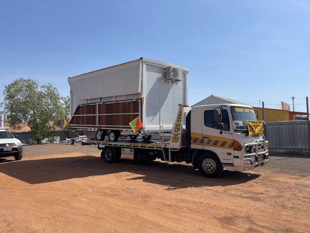 White Truck Transporting a White Container With Brown Trim — Prompt Tilt Tray Towing & Recovery in Herbert, NT