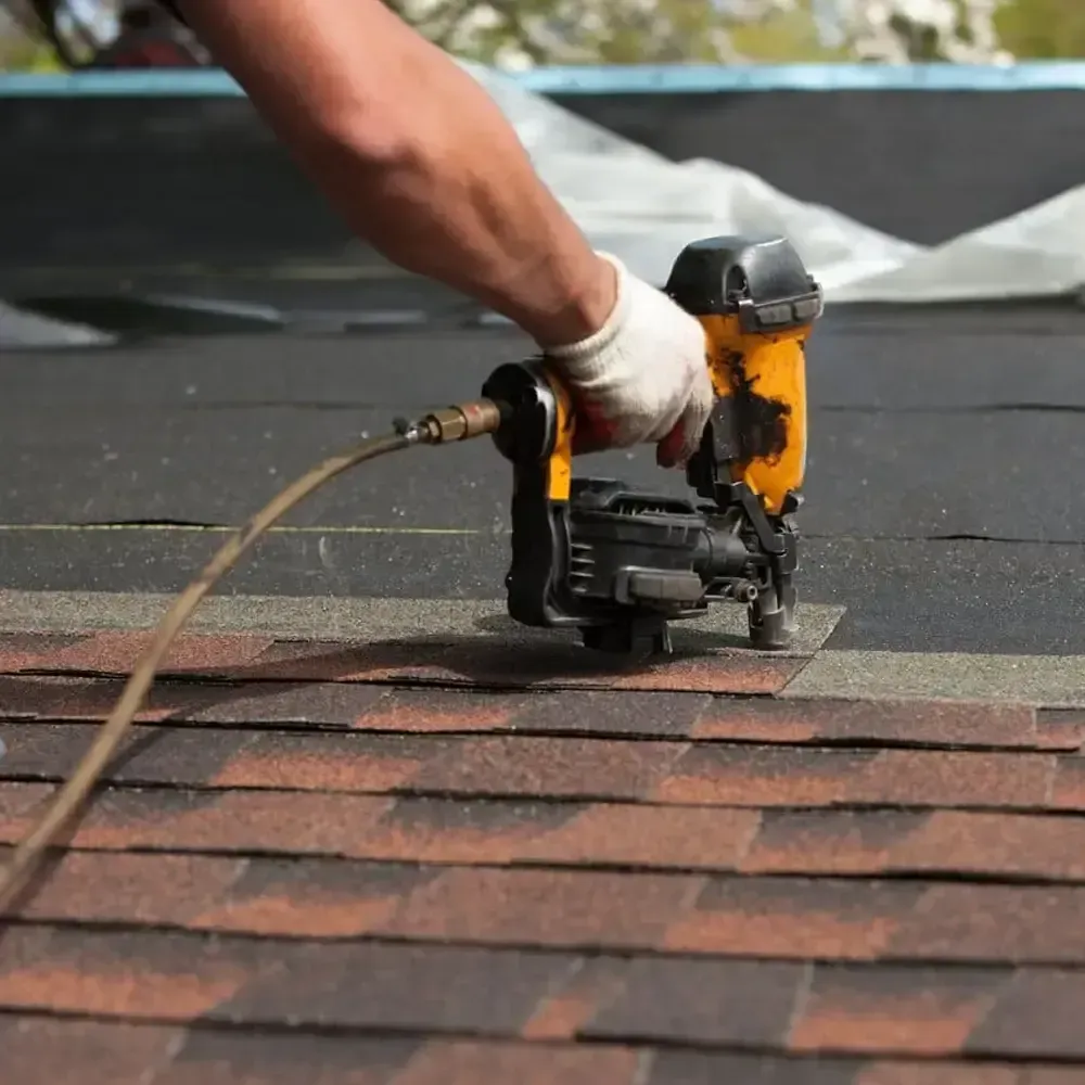 A man fixing a roof