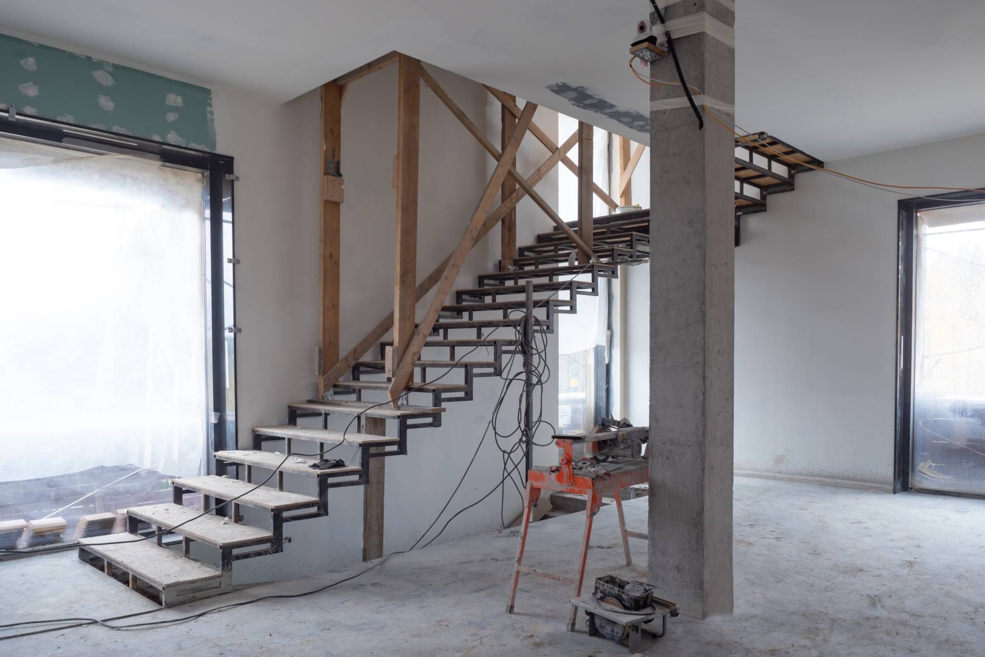 A staircase is being built in a house under construction.
