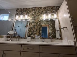 Painter finishing interior trim in a Flat Rock area home