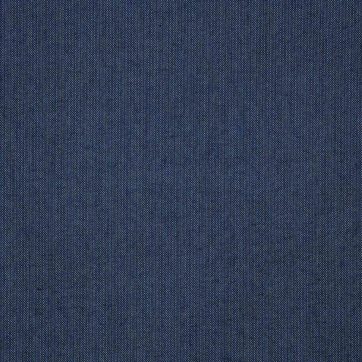 Close-up of blue denim fabric with diagonal woven texture