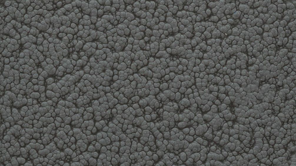 Close-up of a gray, rough pebble-like surface texture