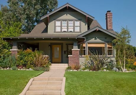 A house with stairs leading up to the front door