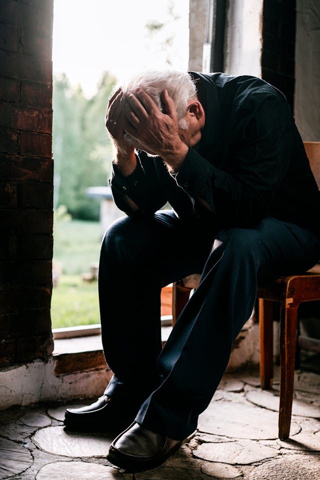 An old man grieving from the loss of a loved one in Laredo, TX