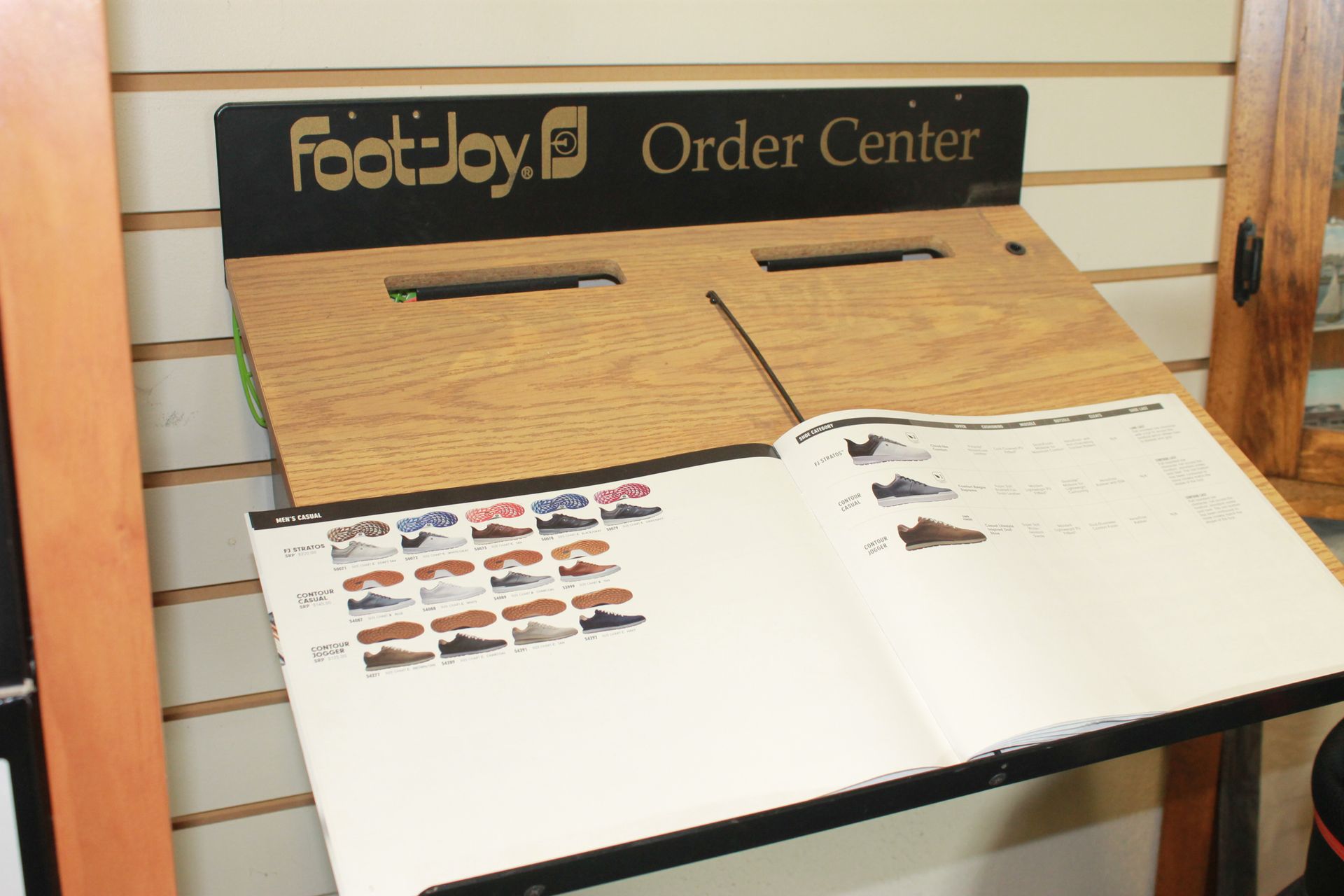 FootJoy Order Center display with product samples and order sheets on a stand