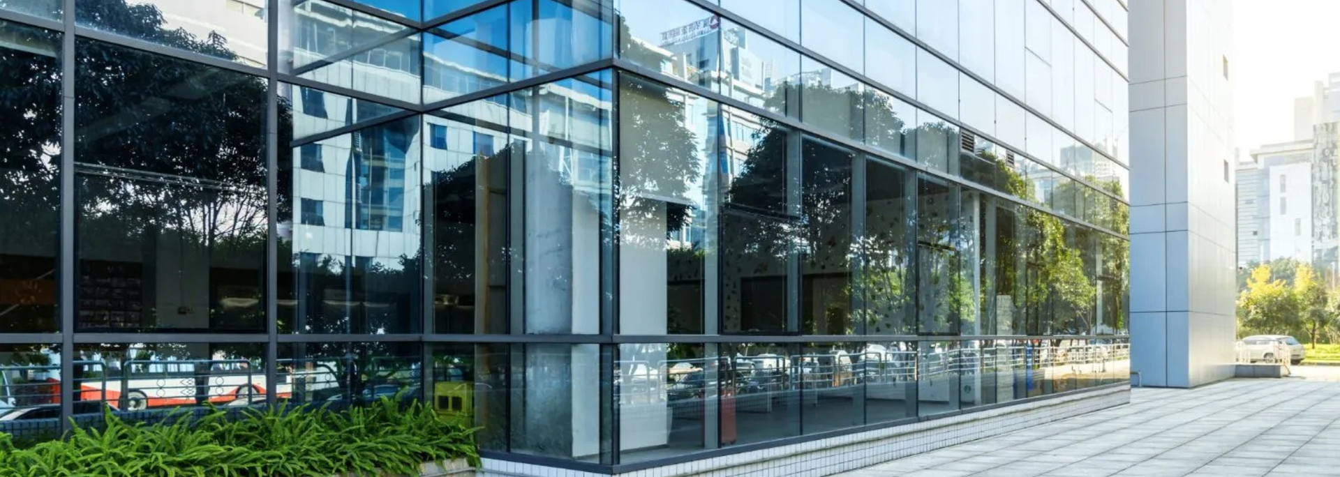Picture of a glass curtain wall on a building. Picture of a glass curtain wall on a building.