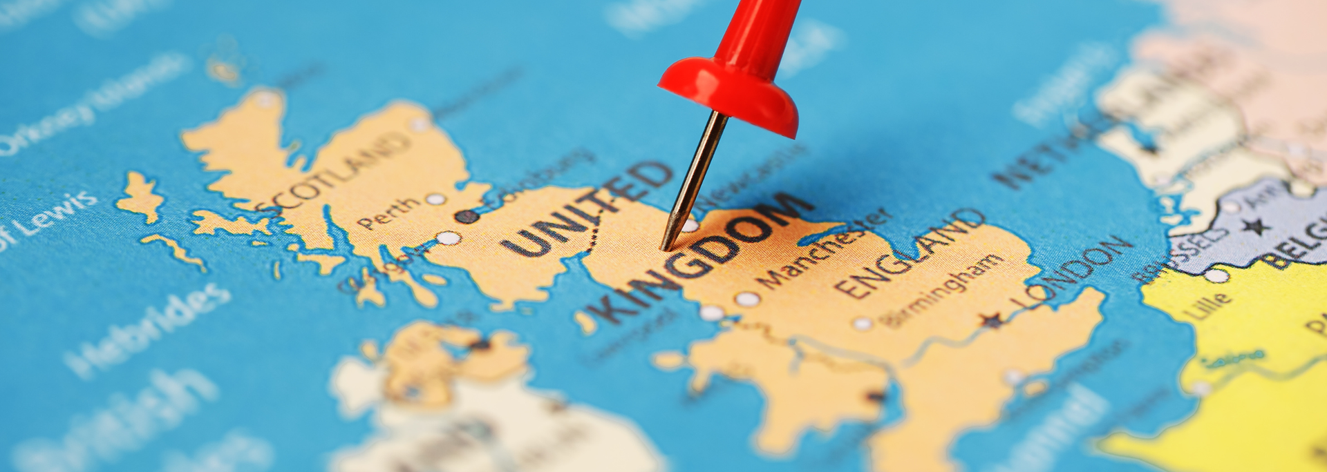 Picture of England pinned on a map. 