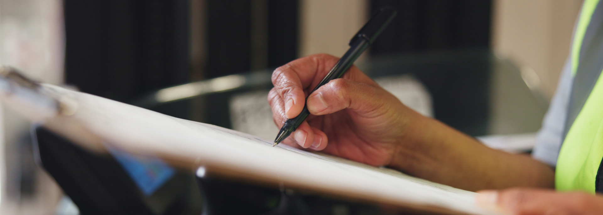 Picture of someone writing on a clipboard. Picture of someone writing on a clipboard.