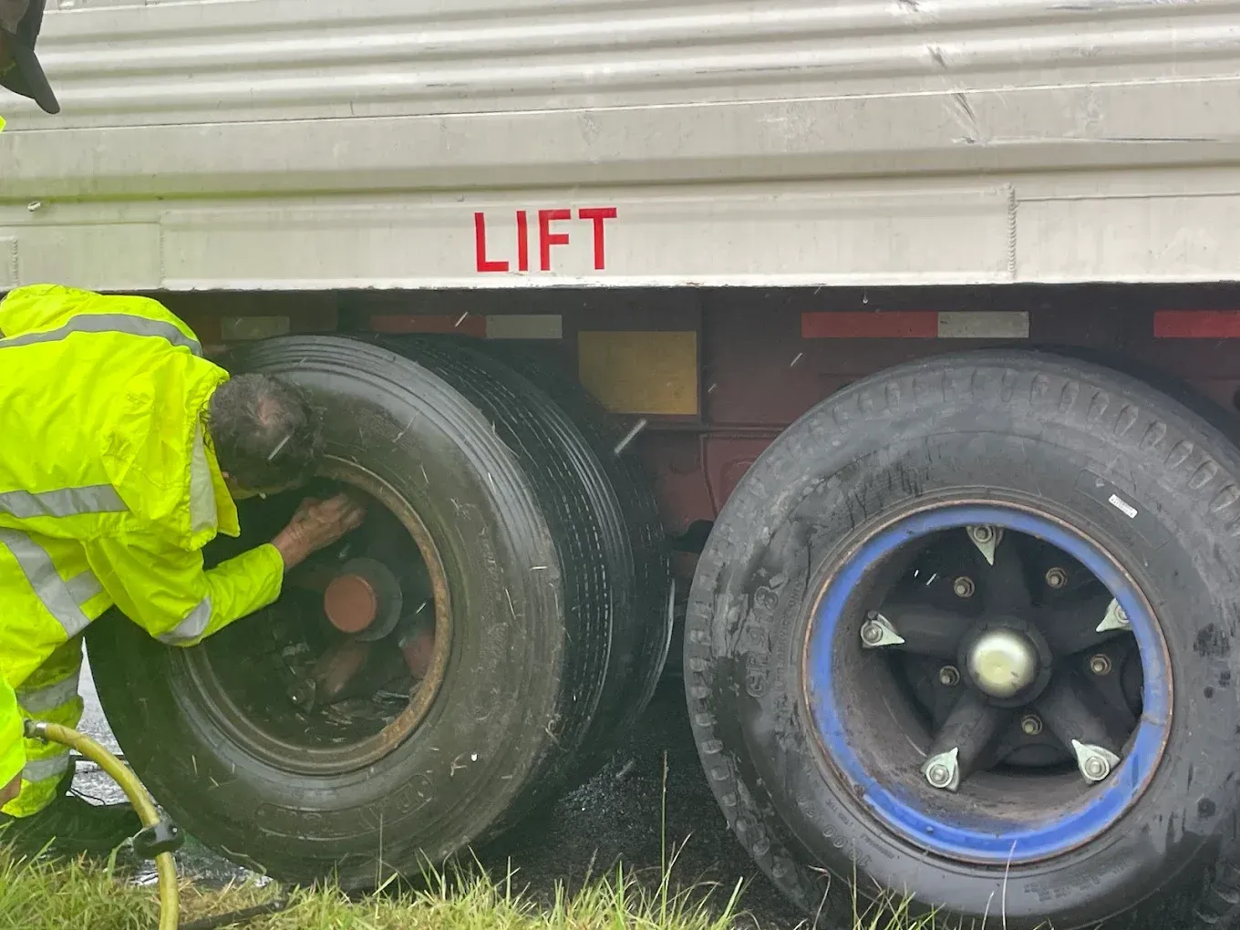 Mobile mechanic truck parked roadside next to a broken-down semi-truck on a South Georgia highway
