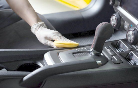 Detailing professional cleaning car interior console