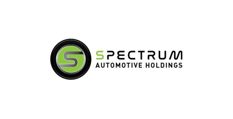 The logo for spectrum automotive holdings is green and black.
