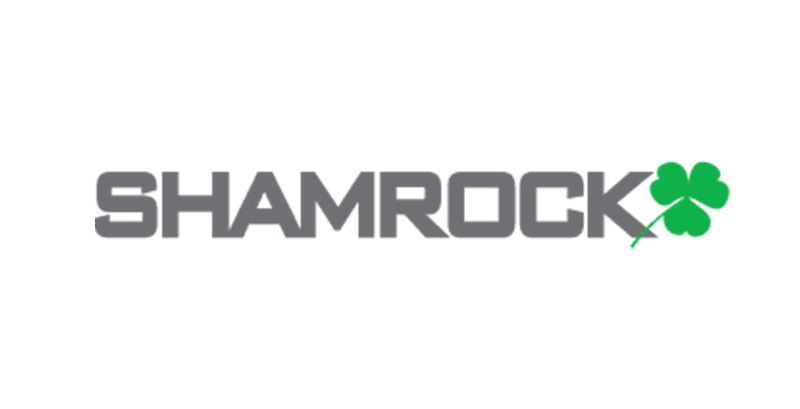 A company shamrock logo with a green shamrock on a white background.