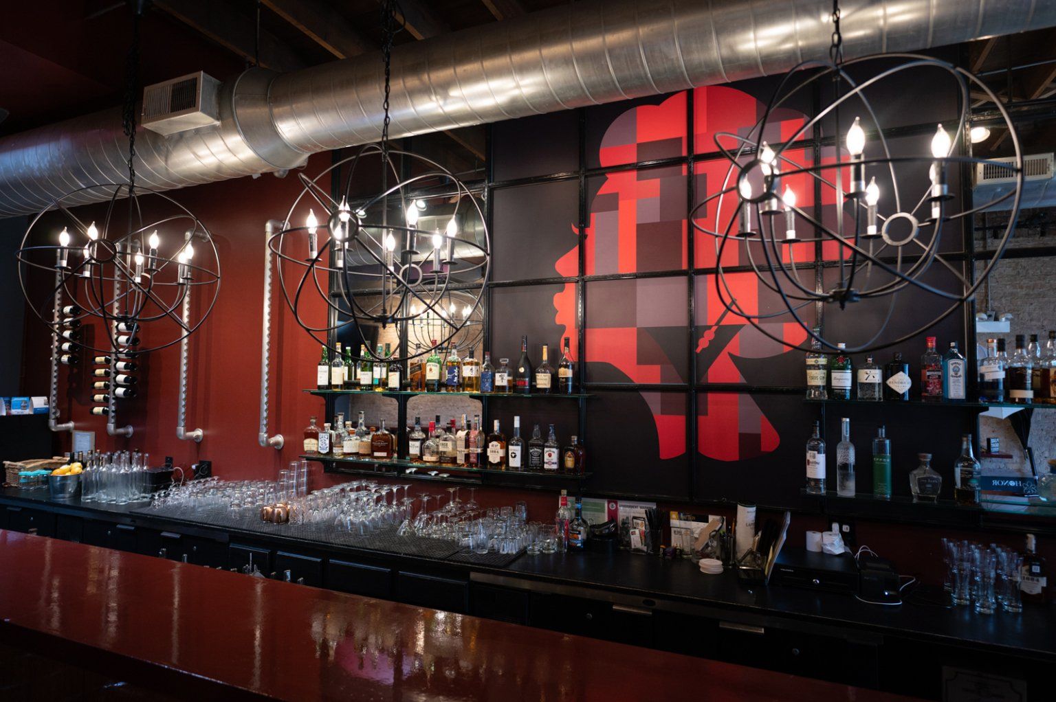 A bar with a silhouette of a man on the wall