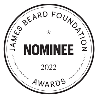 James Beard Foundation Awards nominee badge, 2022. Black text on white circle.