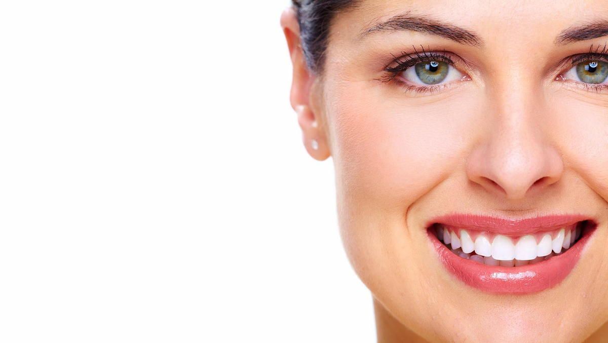 woman smiling covering whole face - Lincoln, NE - Blome Family Dentistry