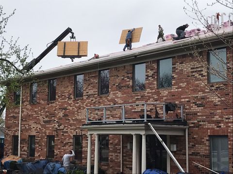 ameriserve employees working on roof