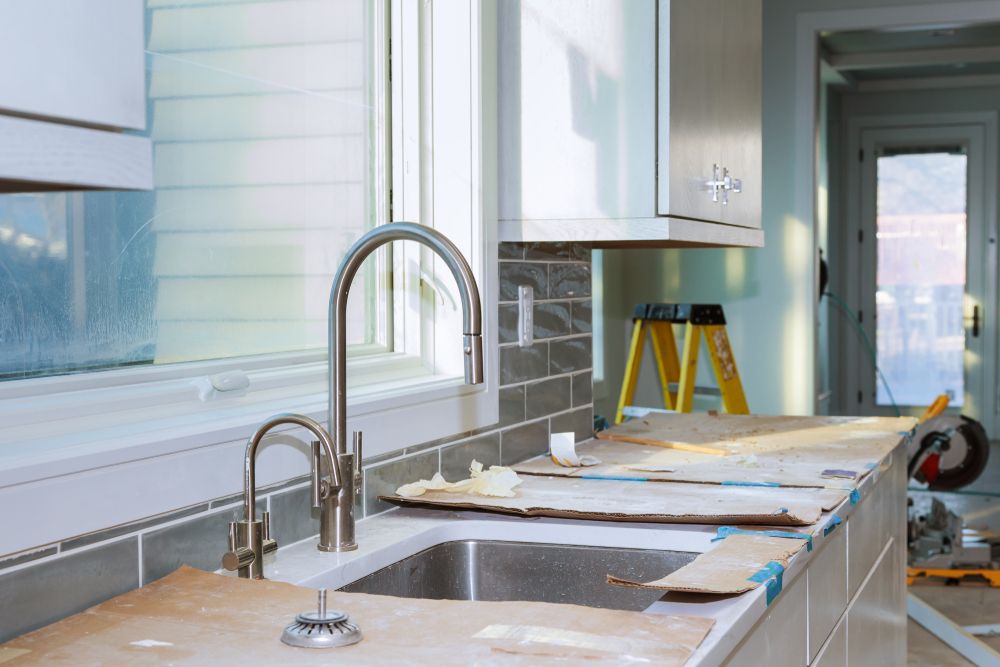 A Kitchen Under Construction With a Sink and a Window — Bathurst Bathroom Solutions In Eglinton, NSW
