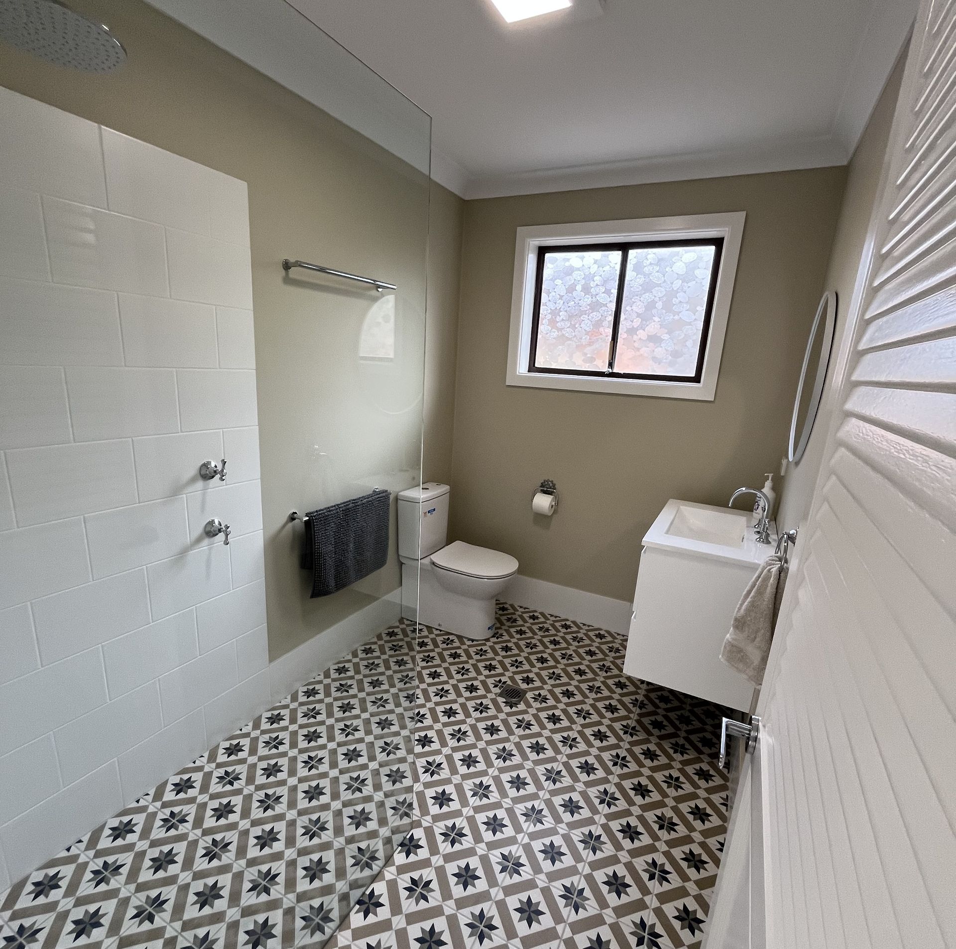 A Bathroom With a Sink, Mirror and Shower — Bathurst Bathroom Solutions In Eglinton, NSW