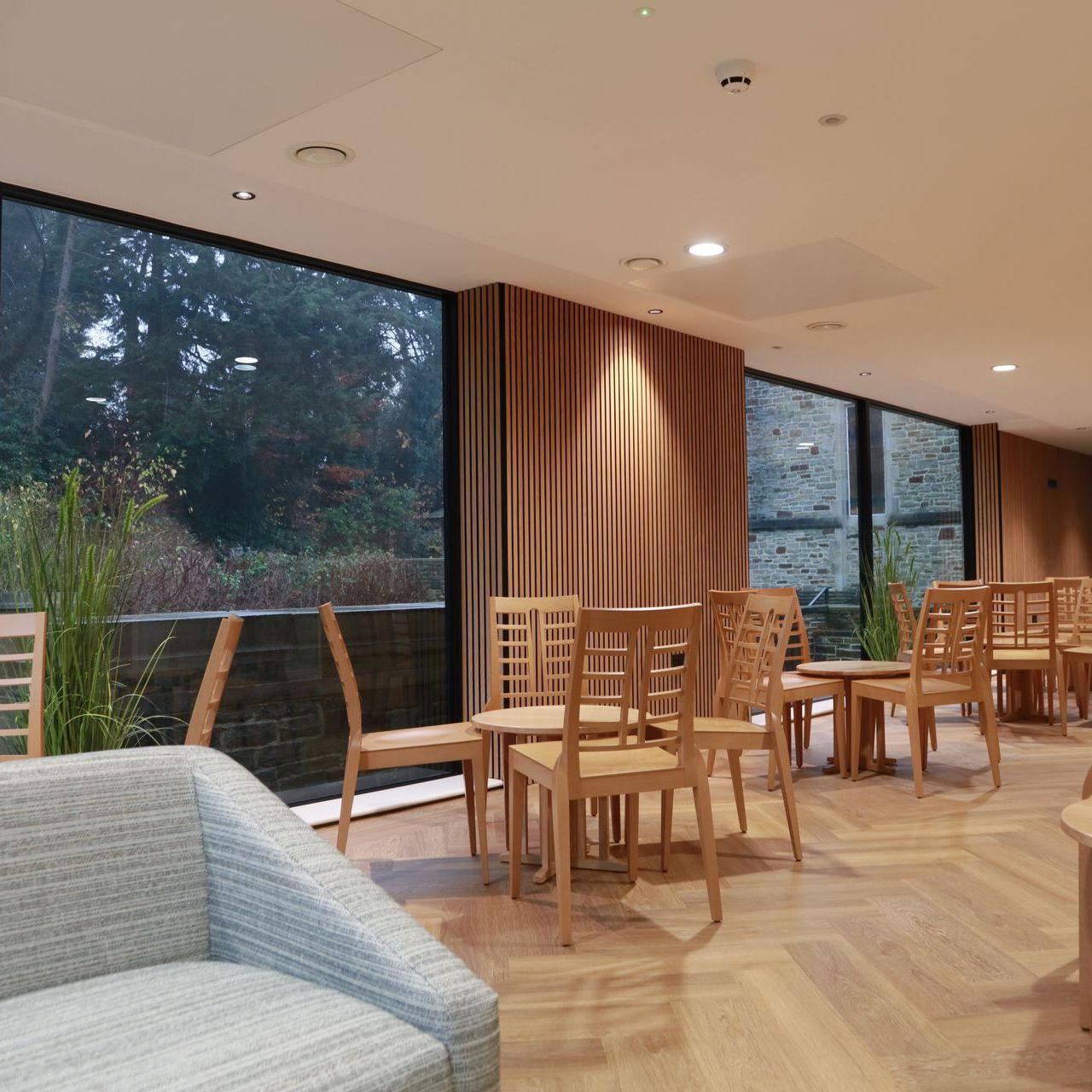 A room with tables and chairs and a couch