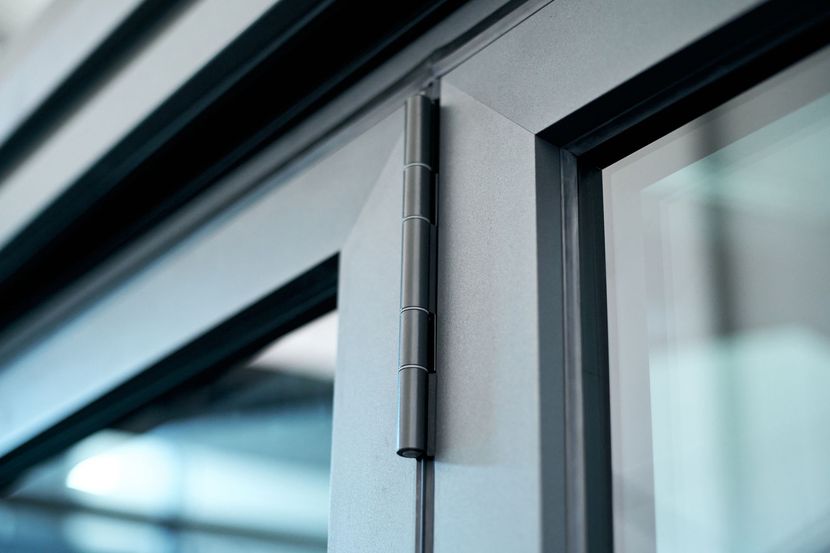 A close up of a door with a hinge on it