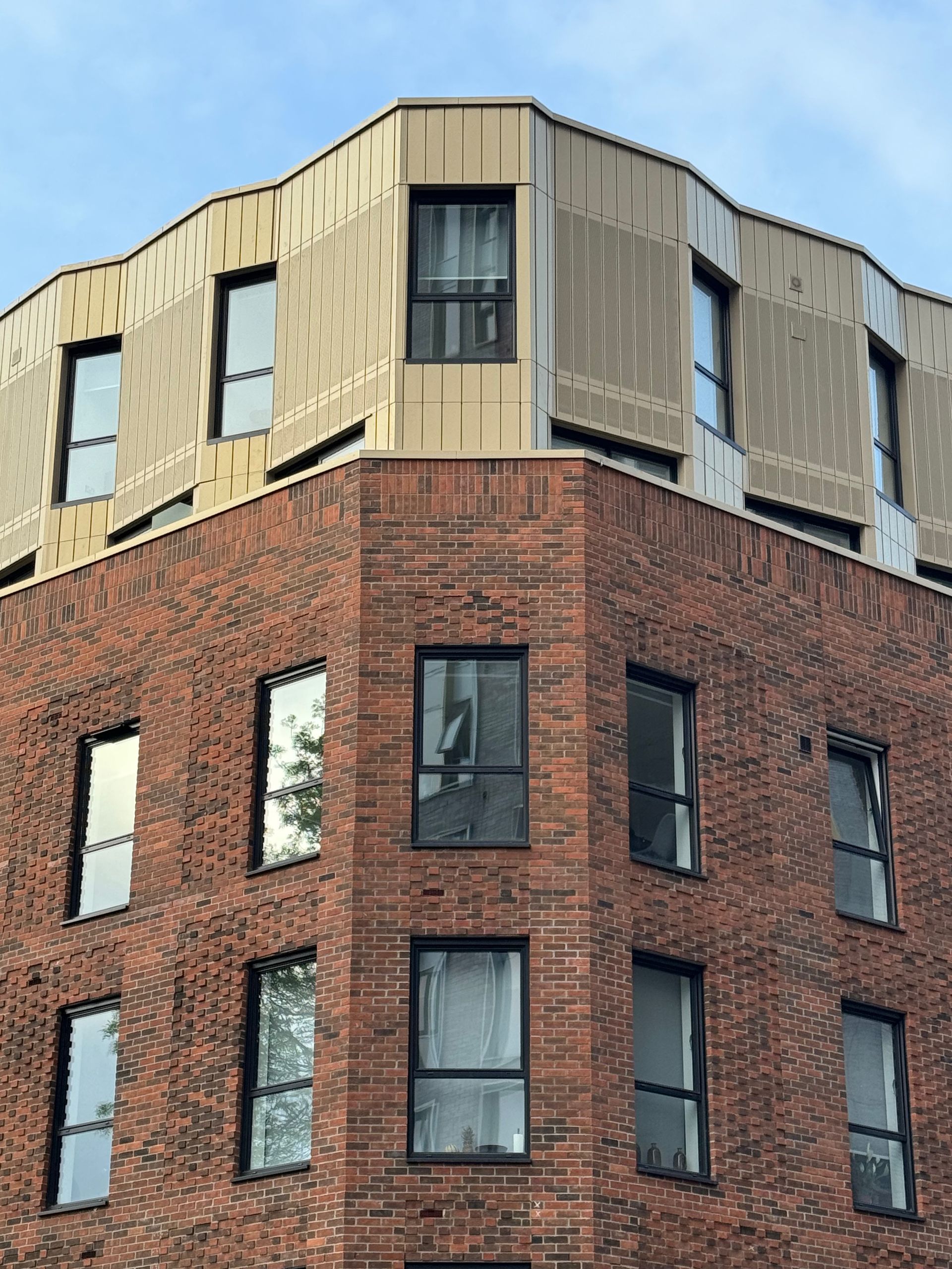 A brick building with a lot of windows on it