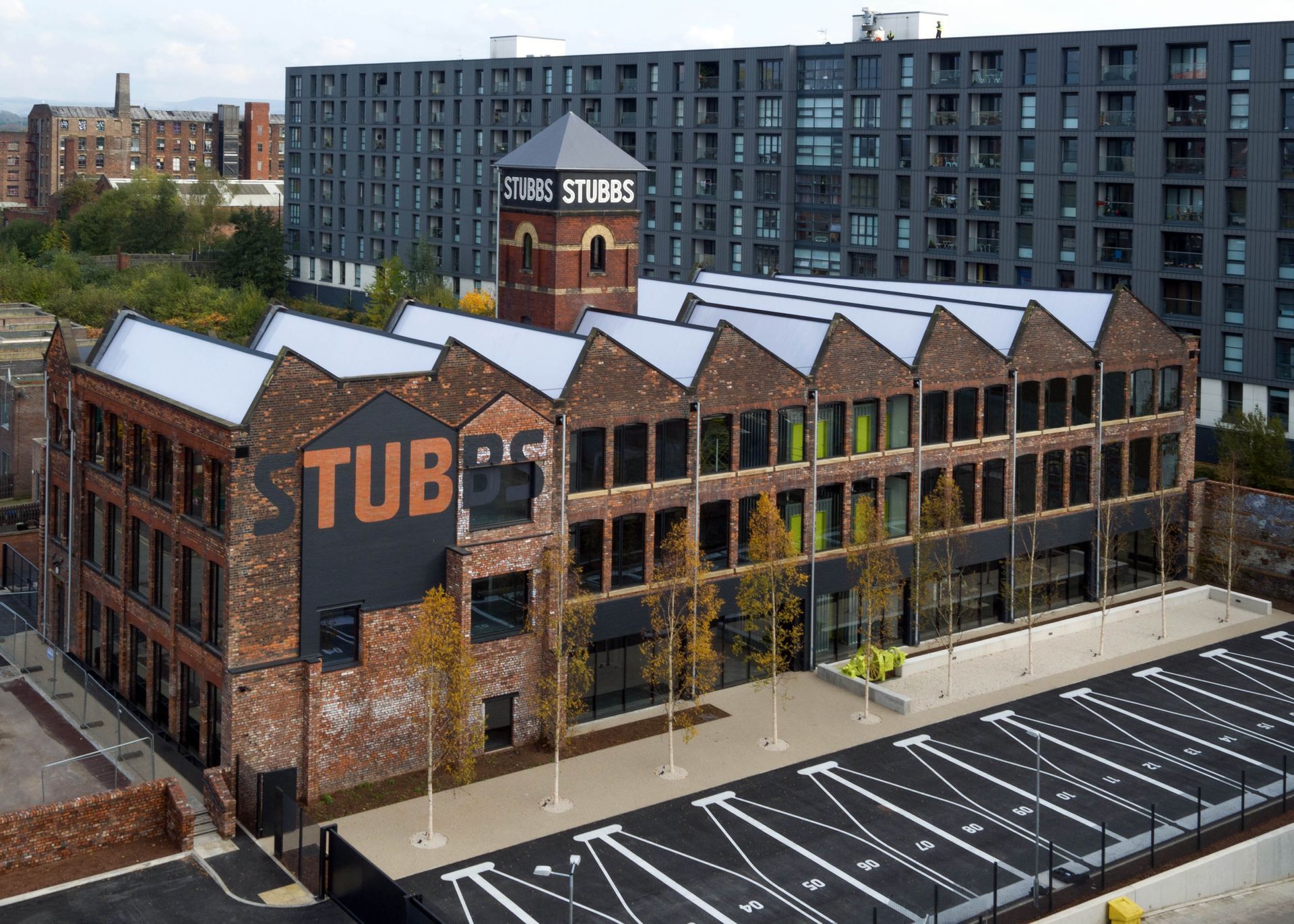 A large brick building with the word tub on it