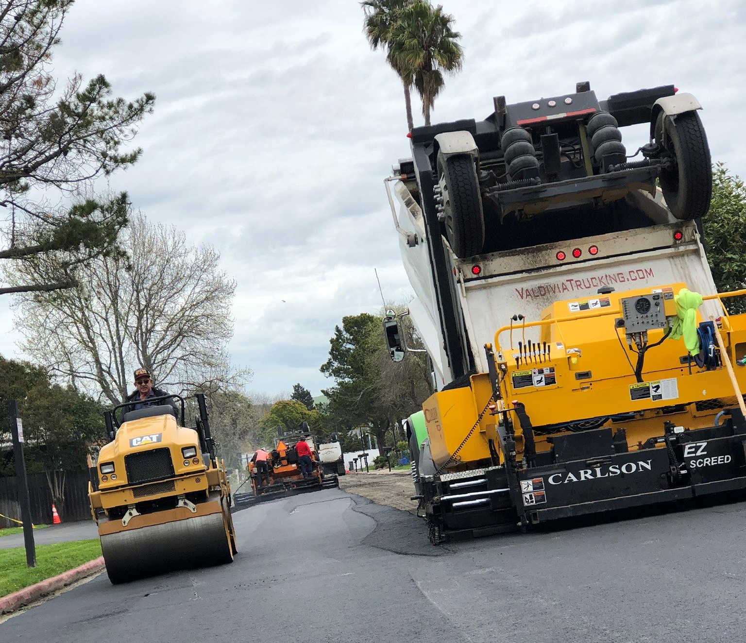 Worker Doing Paving Work — Sebastopol, CA — Gus Golobe Paving Worker Doing Paving Work — Sebastopol, CA — Gus Golobe Paving
