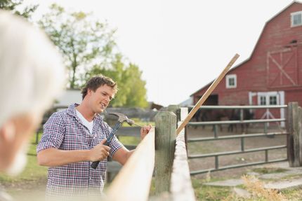 Installing fence on the farm