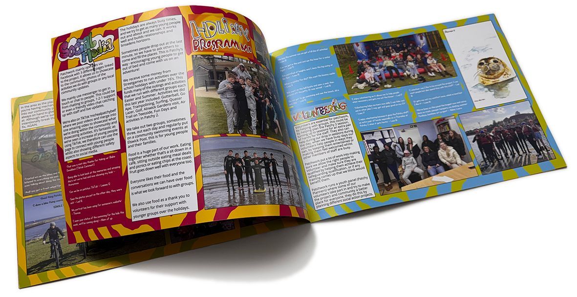 Open scrapbook pages with photos and text blocks.