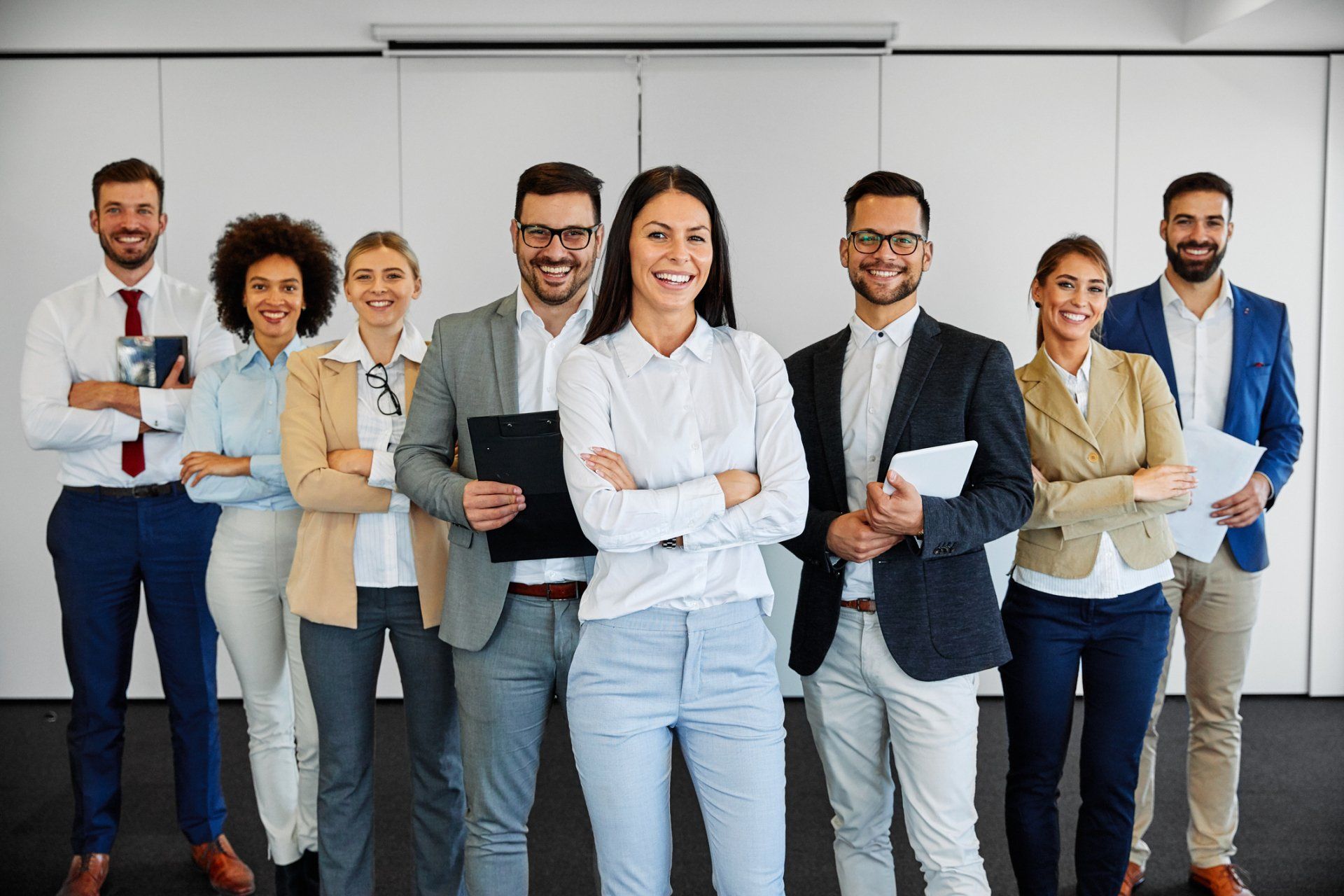 Business Team Smiling — Saginaw, MI — APS Employment Services, Inc Business Team Smiling — Saginaw, MI — APS Employment Services, Inc