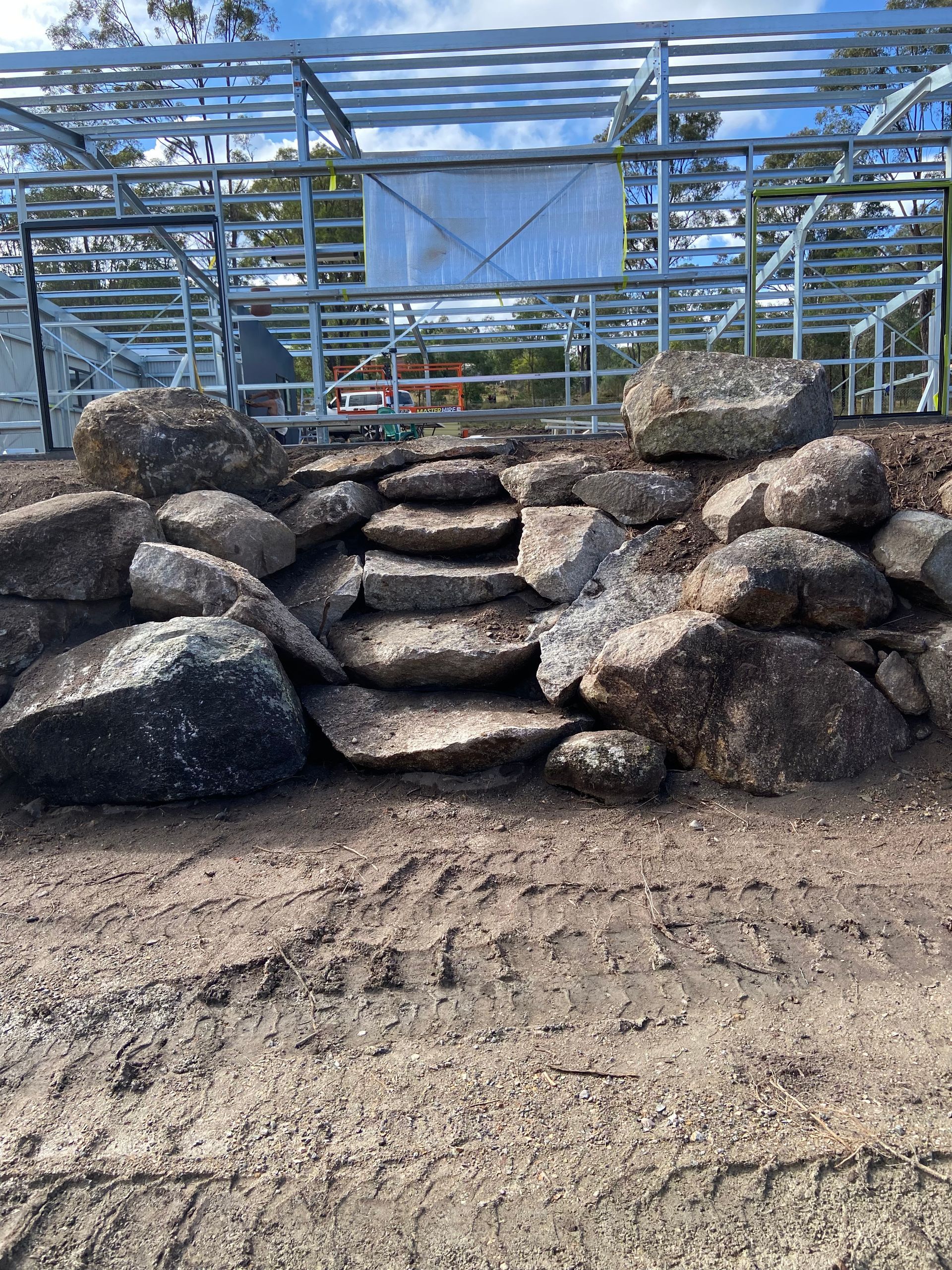 Stone Steps Built Into a Rock Retaining Wall — A1 Rock This City Truck & Dog Hire In Good Night, QLD