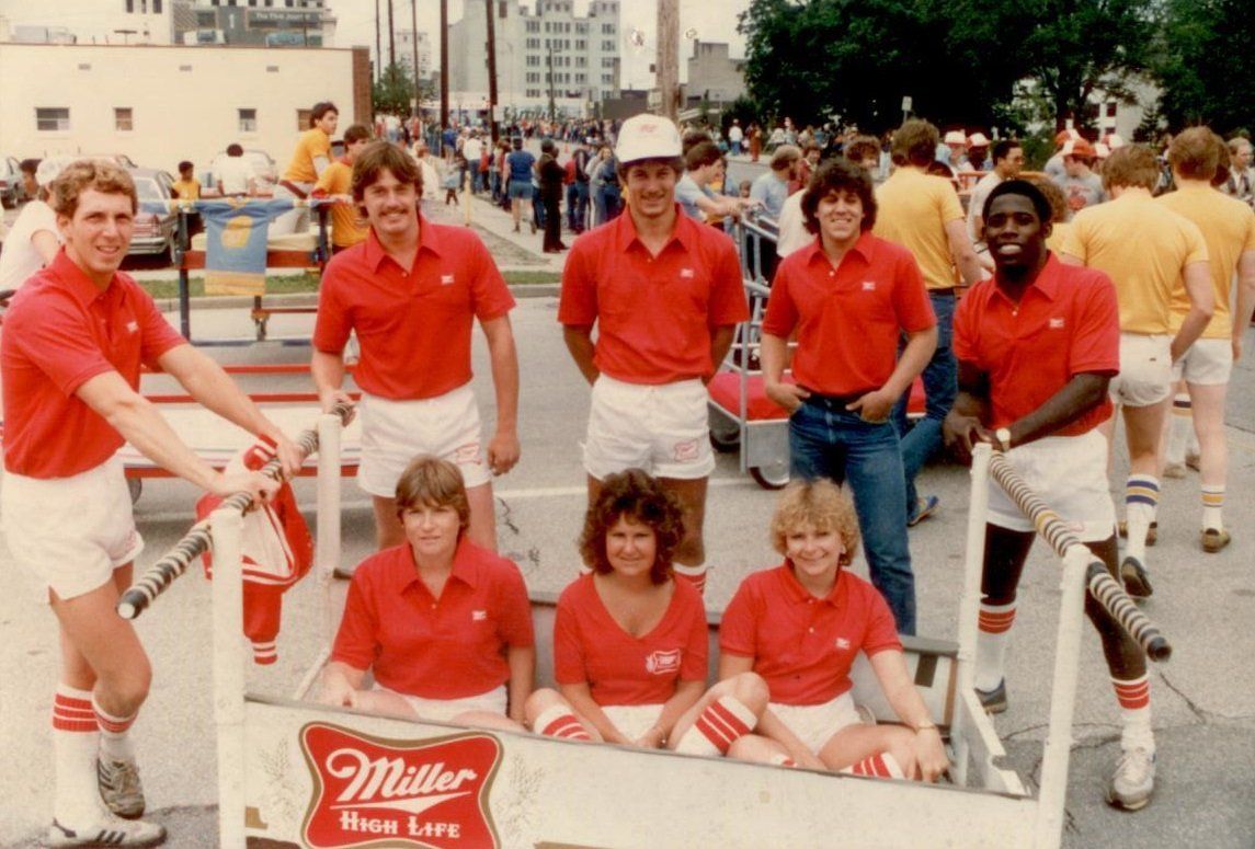 people in a parade representing Miller High Life