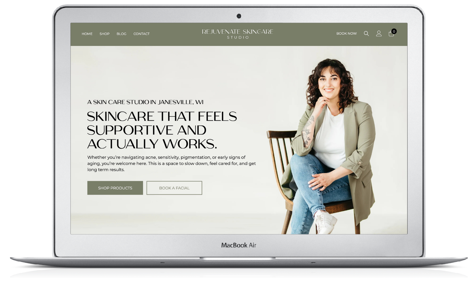 Laptop displaying a skincare clinic website with a seated woman and bold promotional headline on a cream background