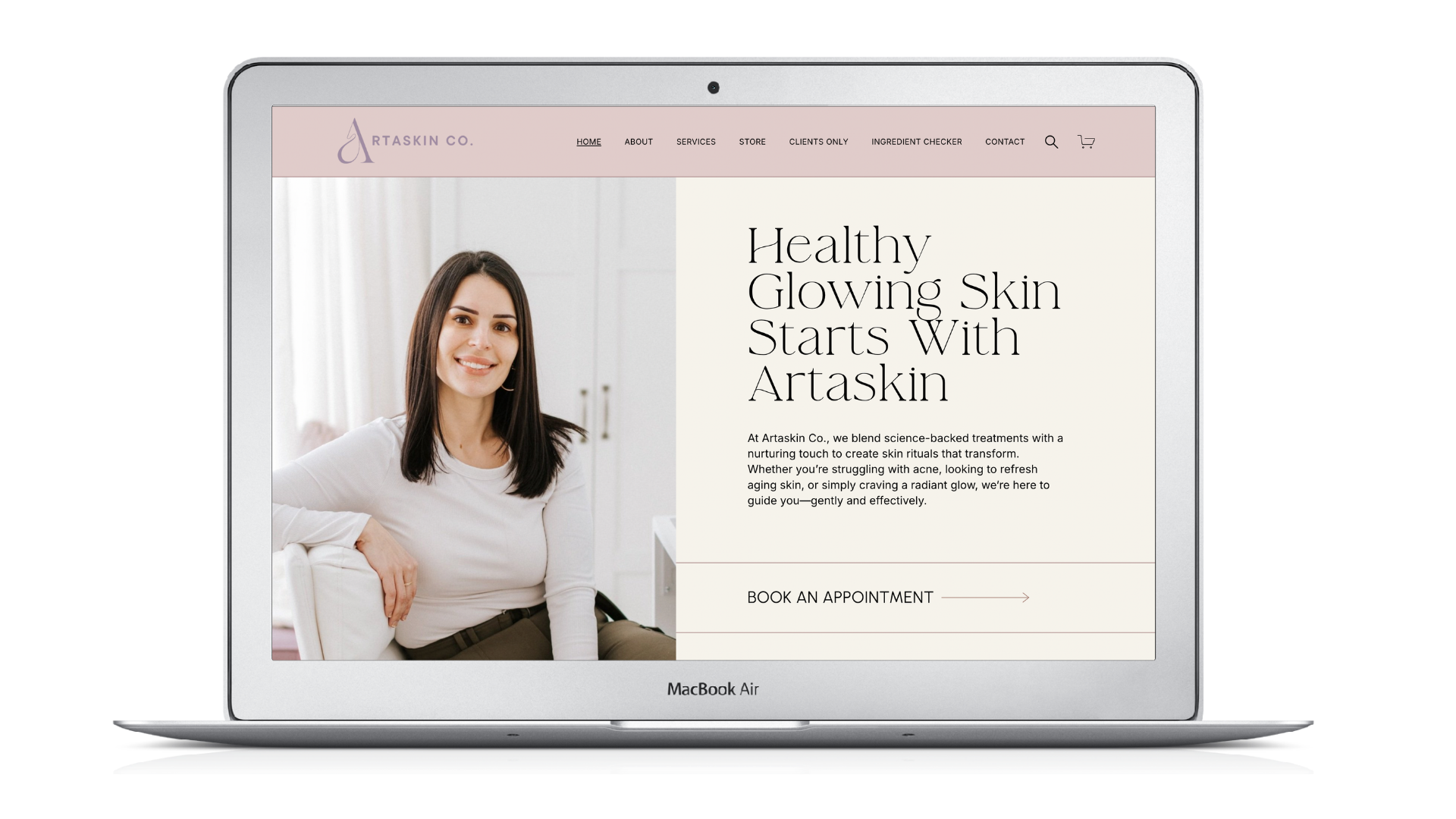 Laptop screen displays Artaskin website with a woman smiling, text 