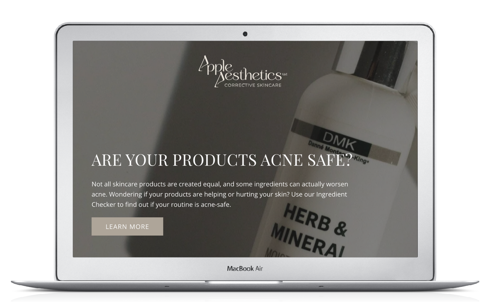 A laptop with a bottle of herb and mineral on the screen.