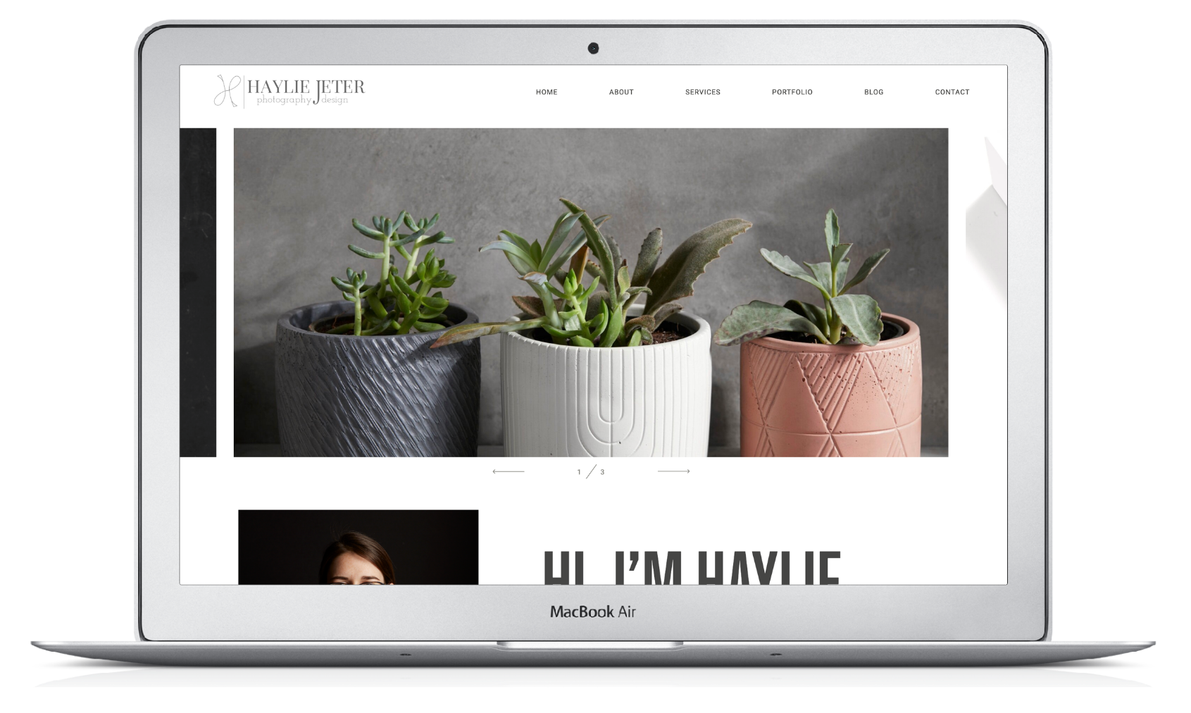 A laptop displaying a professional website with a header featuring three potted succulents and a personal bio section.