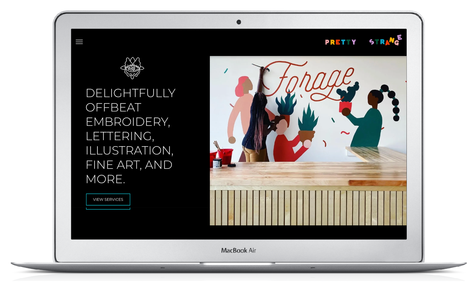 Laptop showing a website homepage with a mural titled 