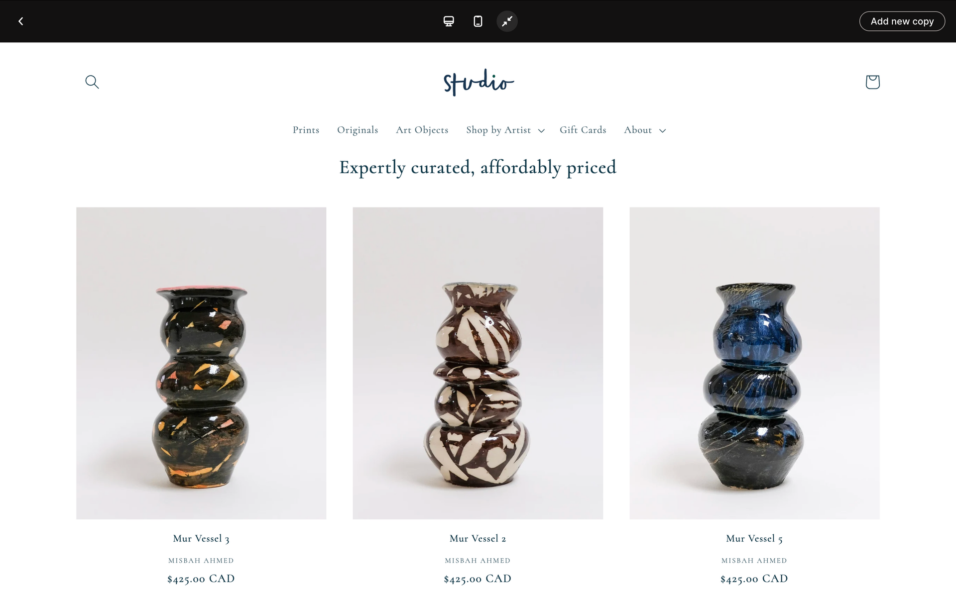 Three decorative stacked vases in black, beige, and blue displayed on a white product page.
