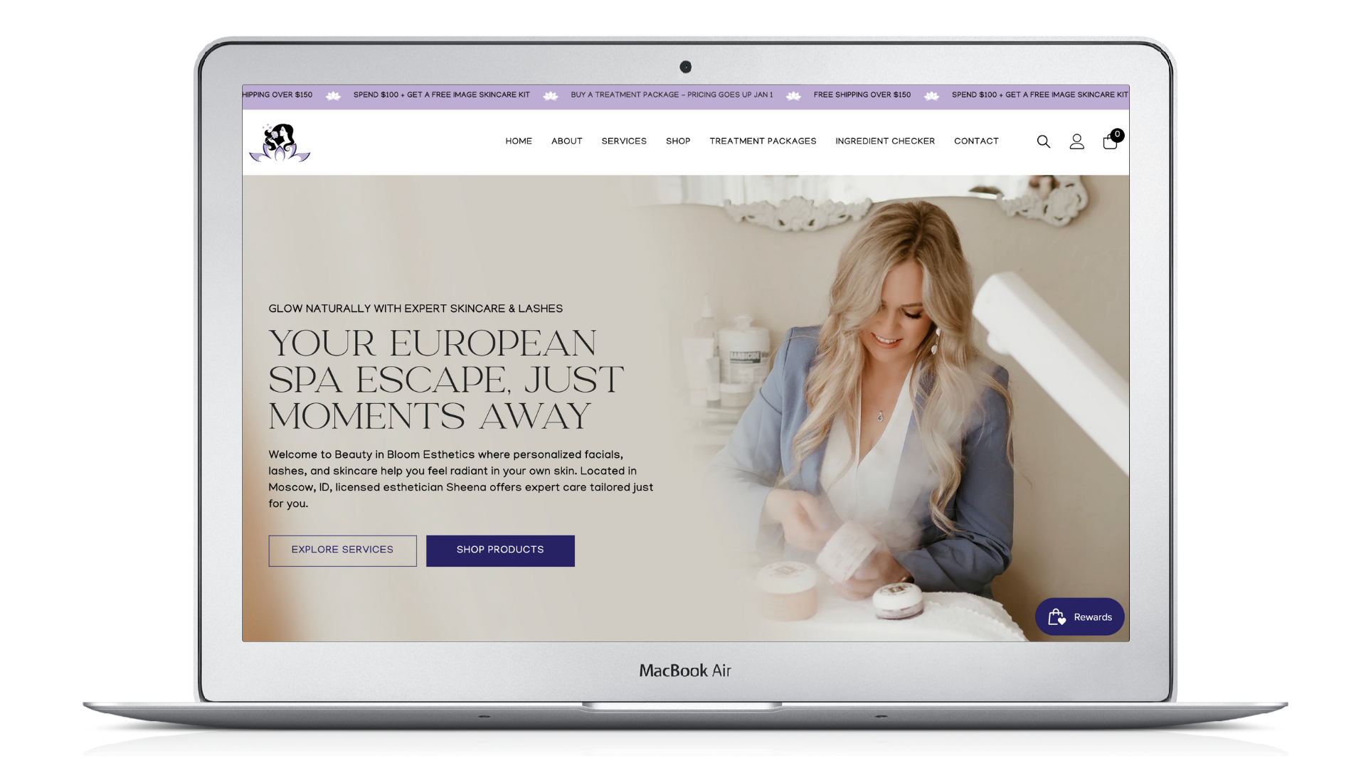 Laptop displaying a spa website with a woman arranging items. Text: