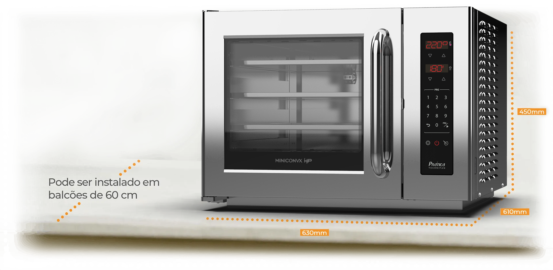 Un horno microondas de acero inoxidable está sobre una mesa.