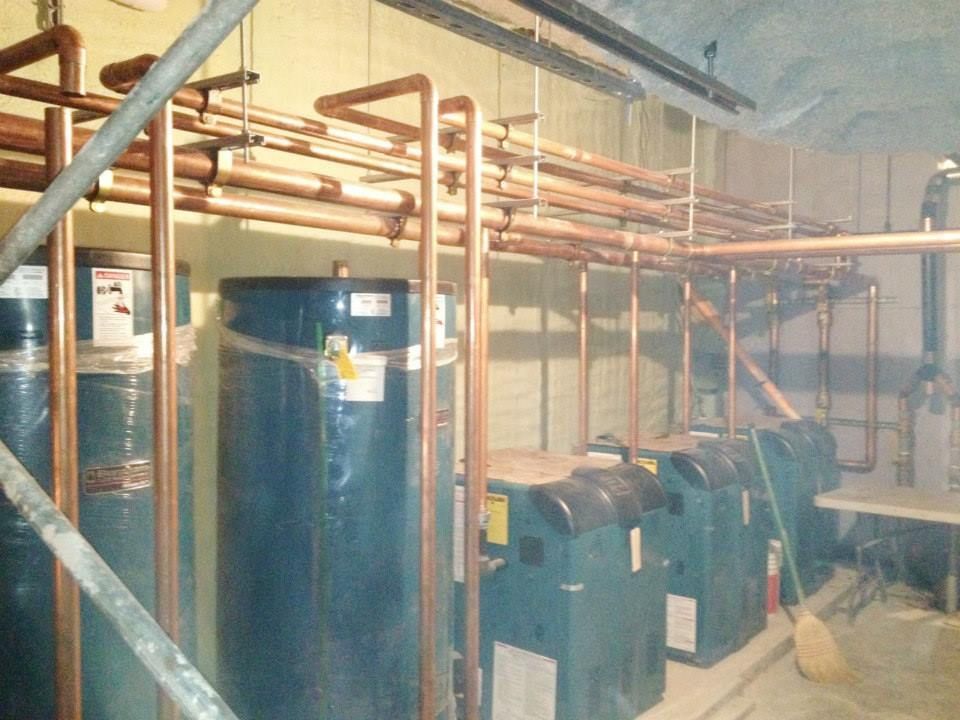 Water Heaters In A Room - Bronx, NY - Pelham Plumbing & Heating Corp