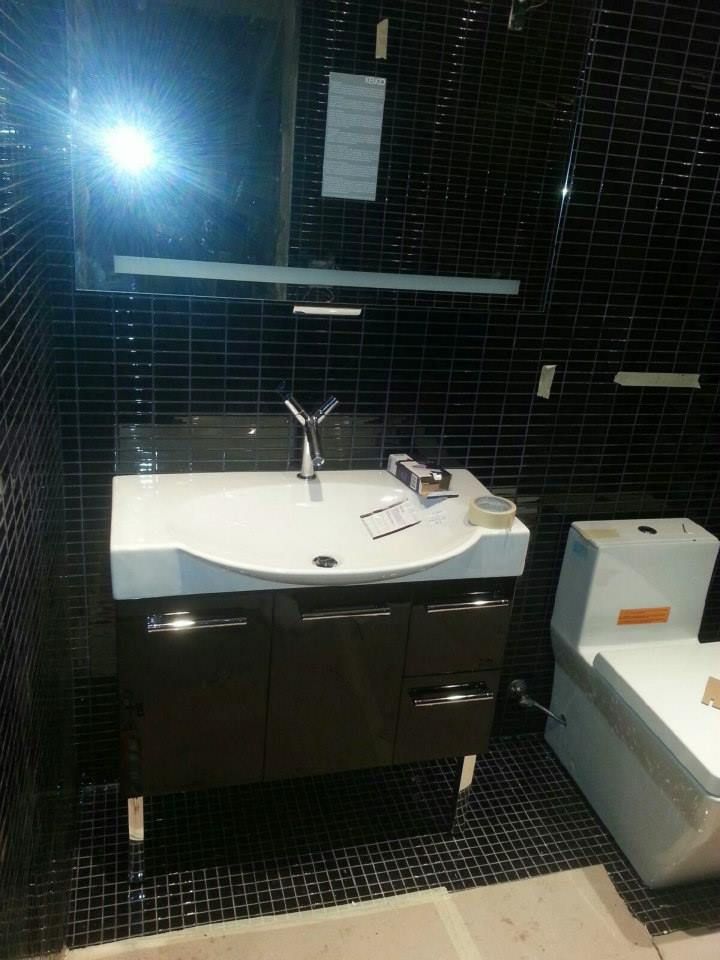 A Sink And Toilet In The Bathroom - Bronx, NY - Pelham Plumbing & Heating Corp
