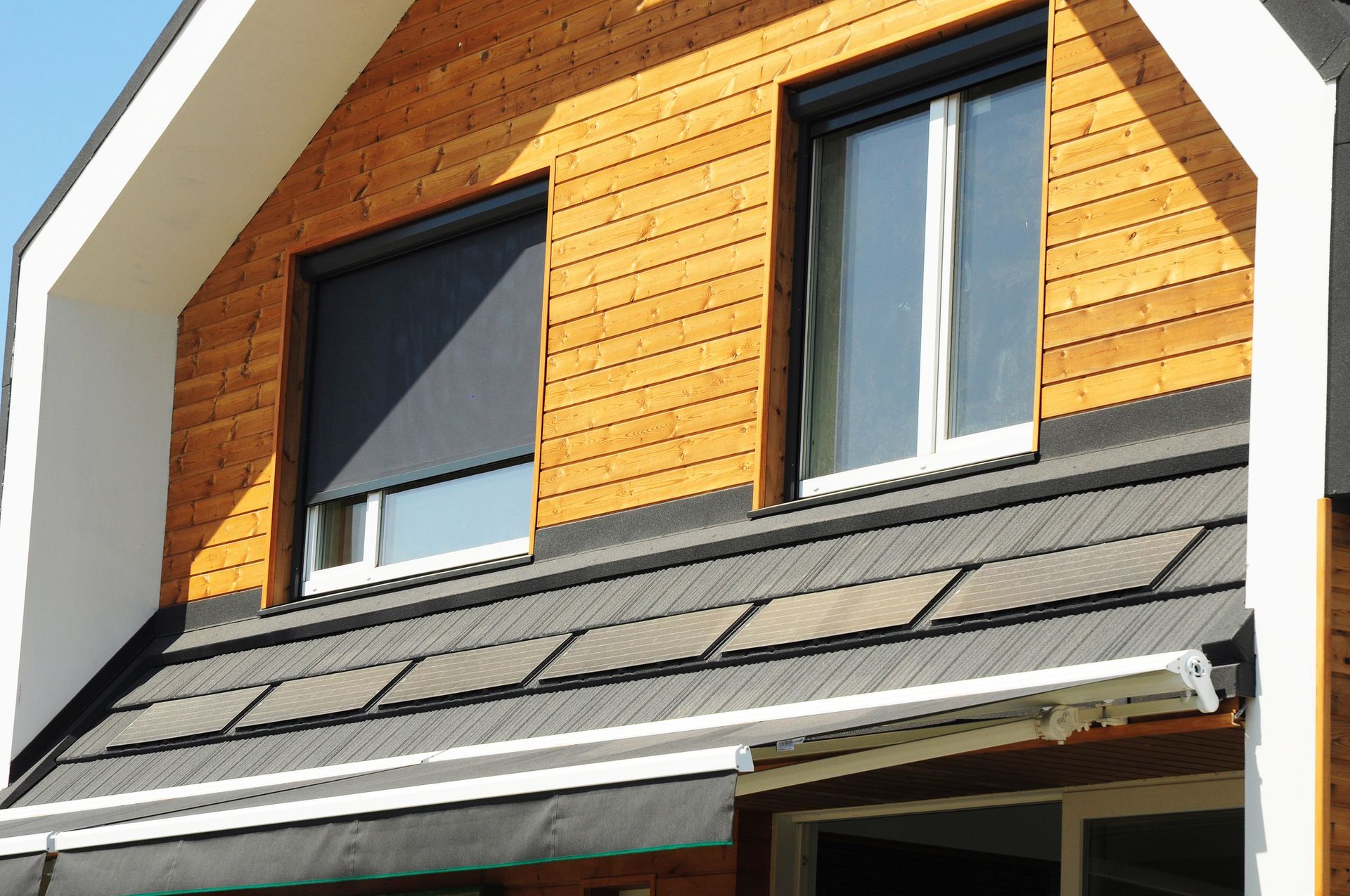 A house with a roof that has shingles on it