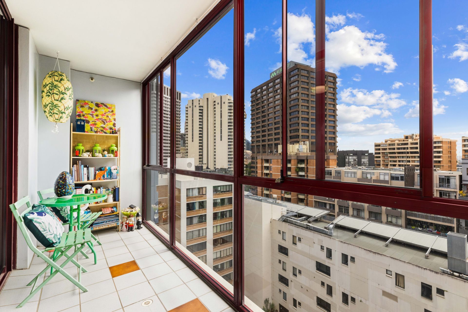 There is a balcony with a view of the city.
