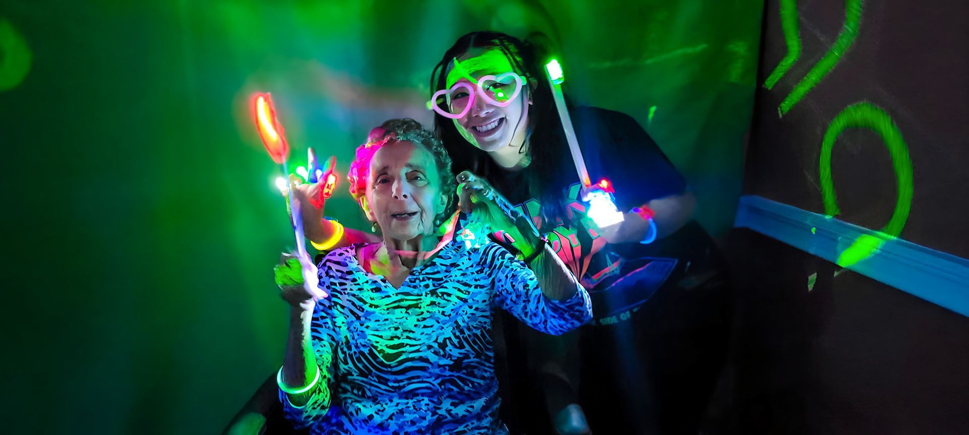 Resident enjoying a sensory light activity at Newburgh Health and Rehab