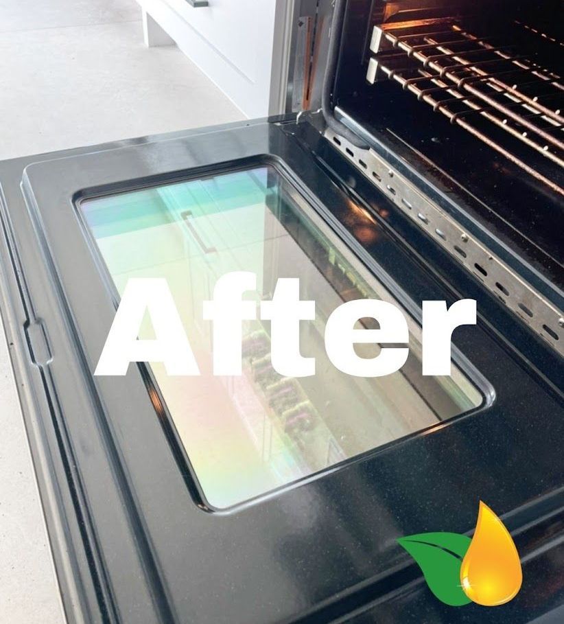 A clean, sparkling oven door shown from an interior angle, with the word