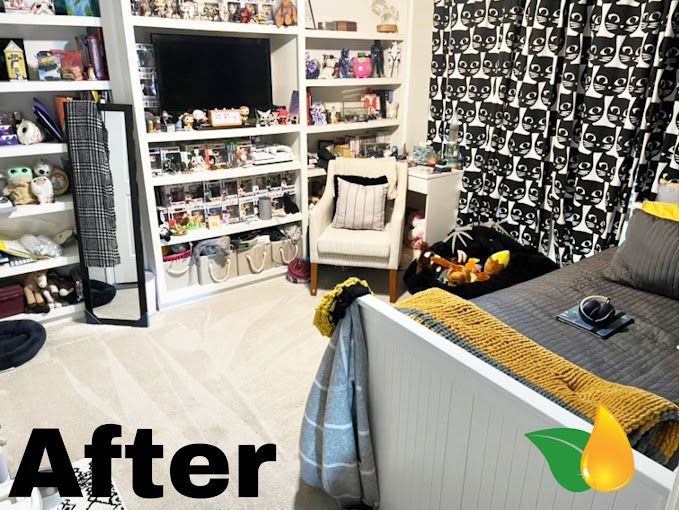 After: tidy bedroom with shelves, chair, bed, and black patterned curtains