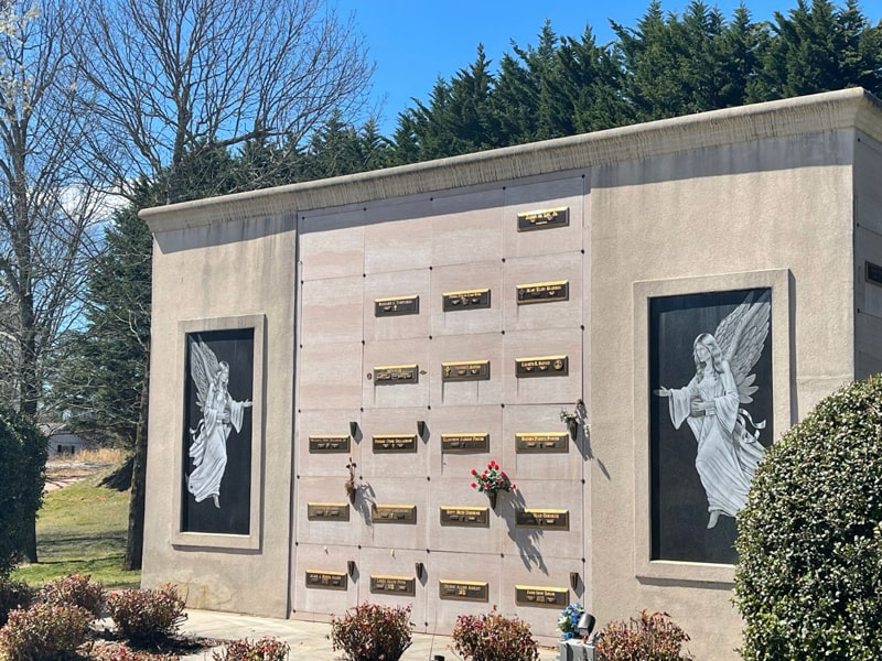 A large building with two angels on the side of it.