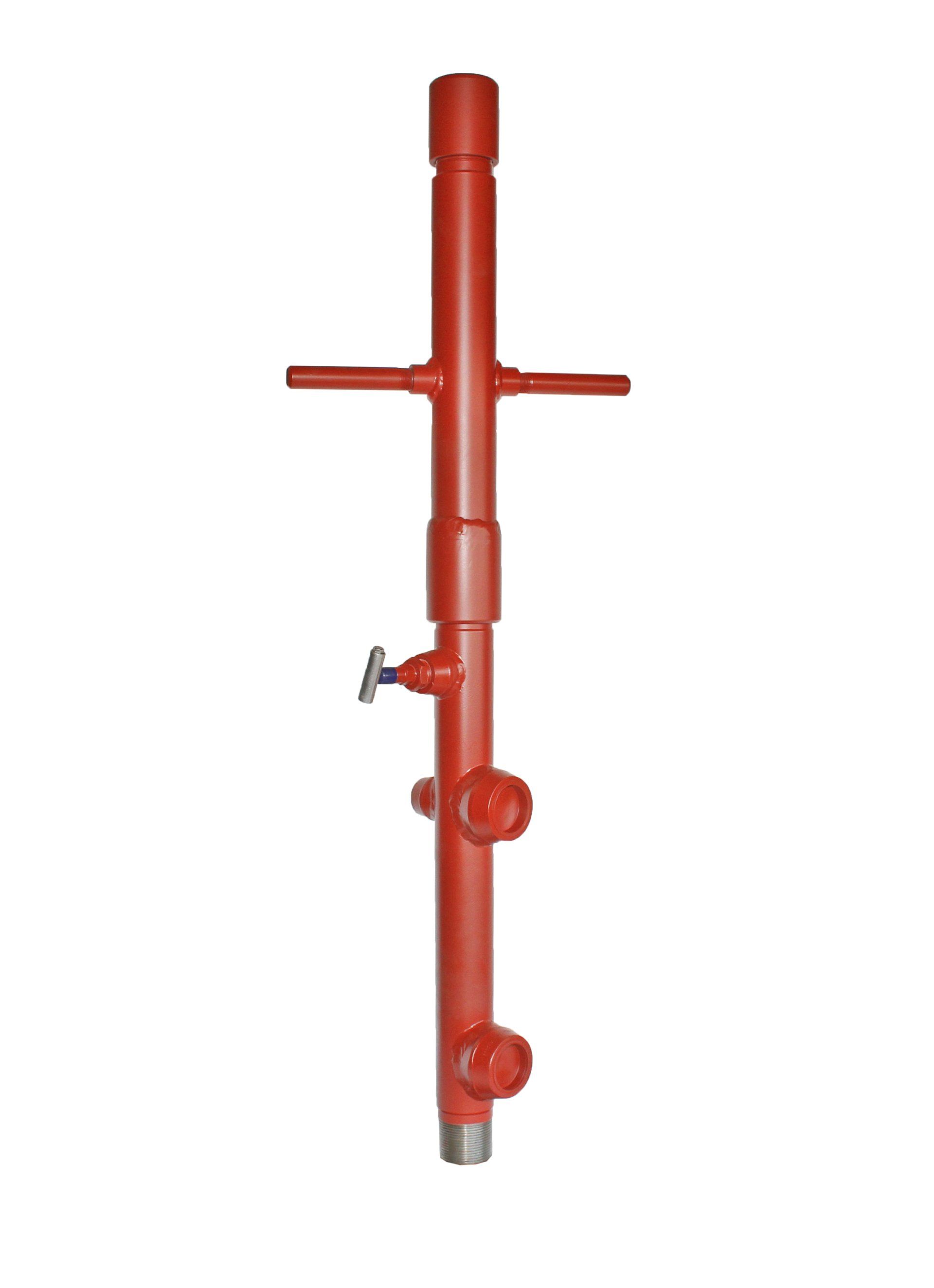 Red oil wellhead with valves and pipes.